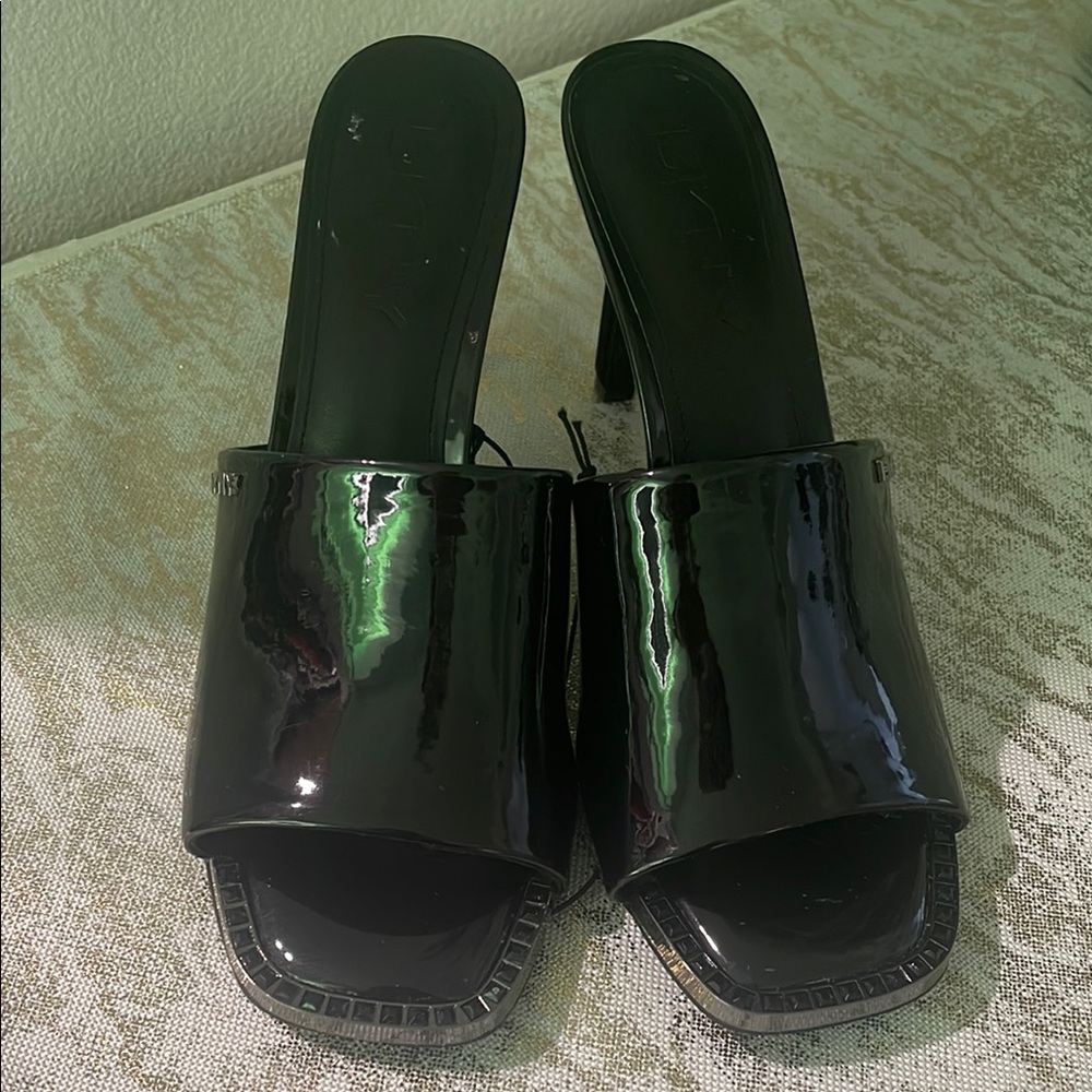 Sleek Black Patent Leather Mules with Moderate Heel